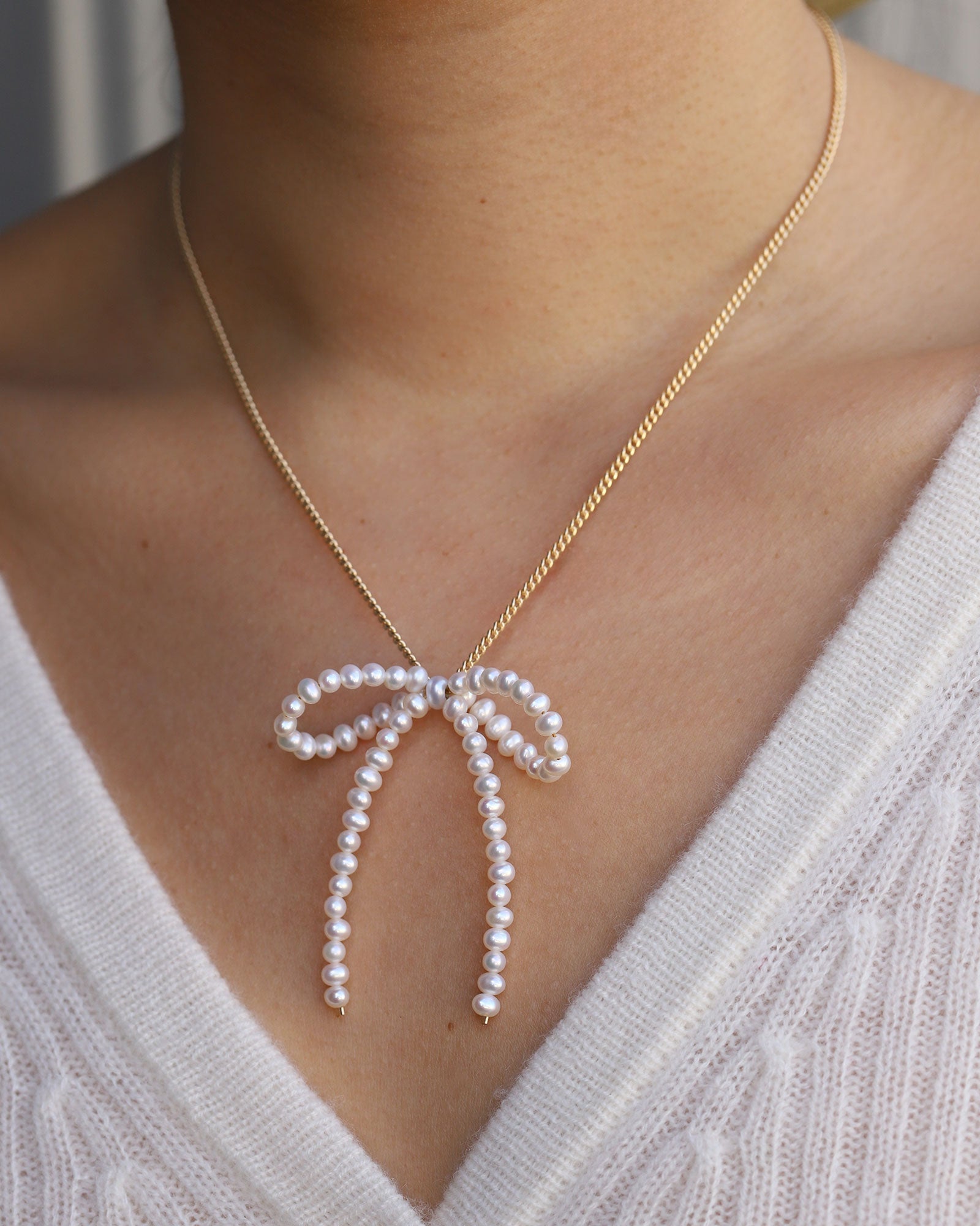 Swarovski bow necklace on sale