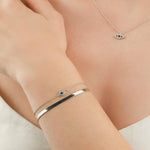 Quiet Icon-Tiny Evil Eye CZ Bracelet-Bracelets-Rhodium Plated Sterling Silver, White Cubic Zirconia, Blue Cubic Zirconia-Blue Ruby Jewellery-Vancouver Canada