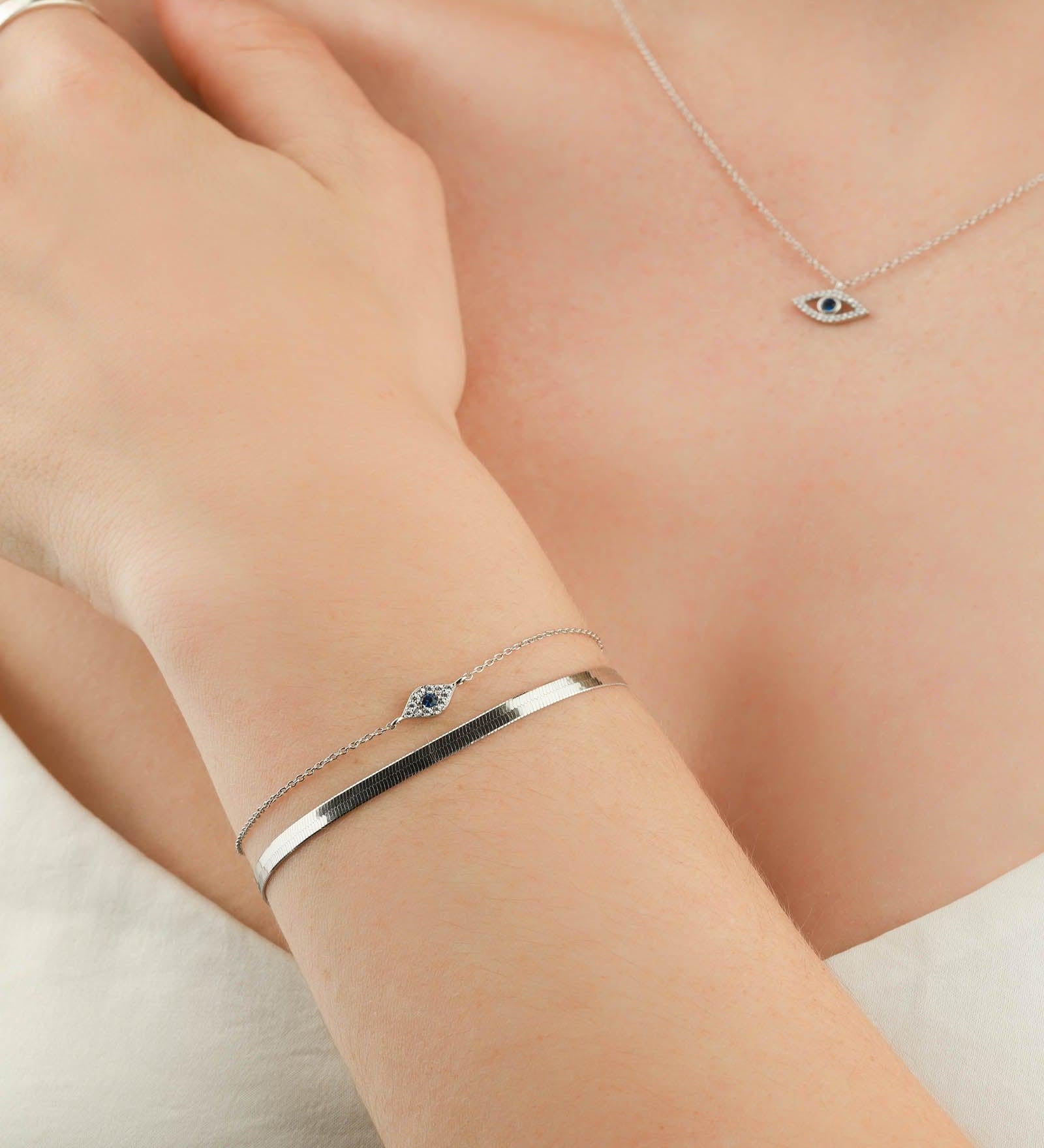 Quiet Icon-Tiny Evil Eye CZ Bracelet-Bracelets-Rhodium Plated Sterling Silver, White Cubic Zirconia, Blue Cubic Zirconia-Blue Ruby Jewellery-Vancouver Canada