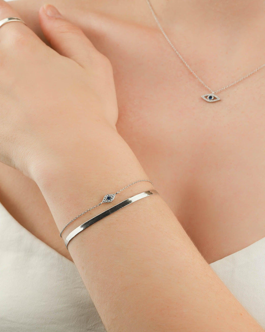 Quiet Icon-Tiny Evil Eye CZ Bracelet-Bracelets-Rhodium Plated Sterling Silver, White Cubic Zirconia, Blue Cubic Zirconia-Blue Ruby Jewellery-Vancouver Canada